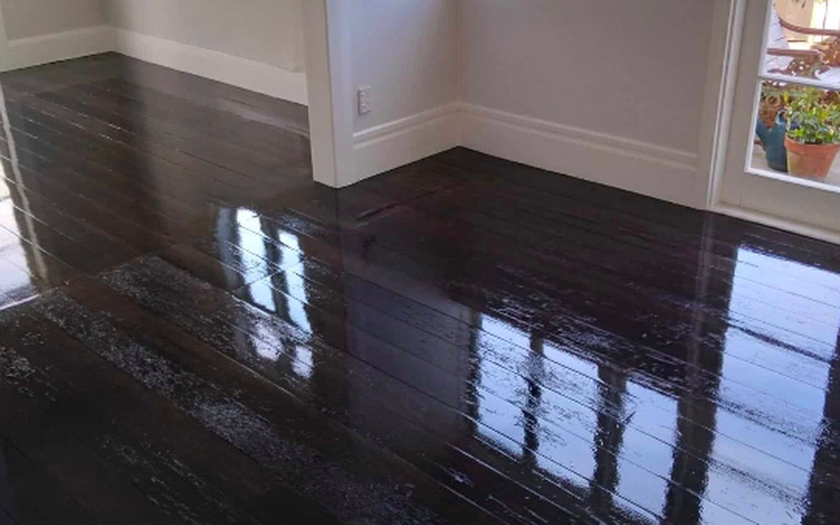 Dark stained timber floor with a high gloss polished finish after floor sanding in Auckland
